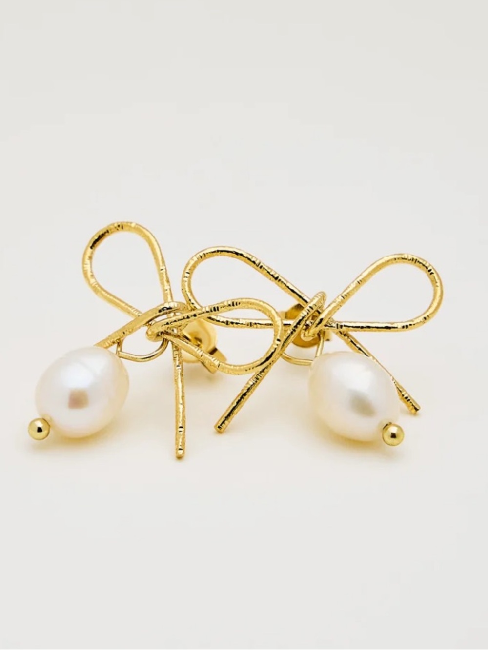 Boutique Gold Bow Pearl Drop Earrings